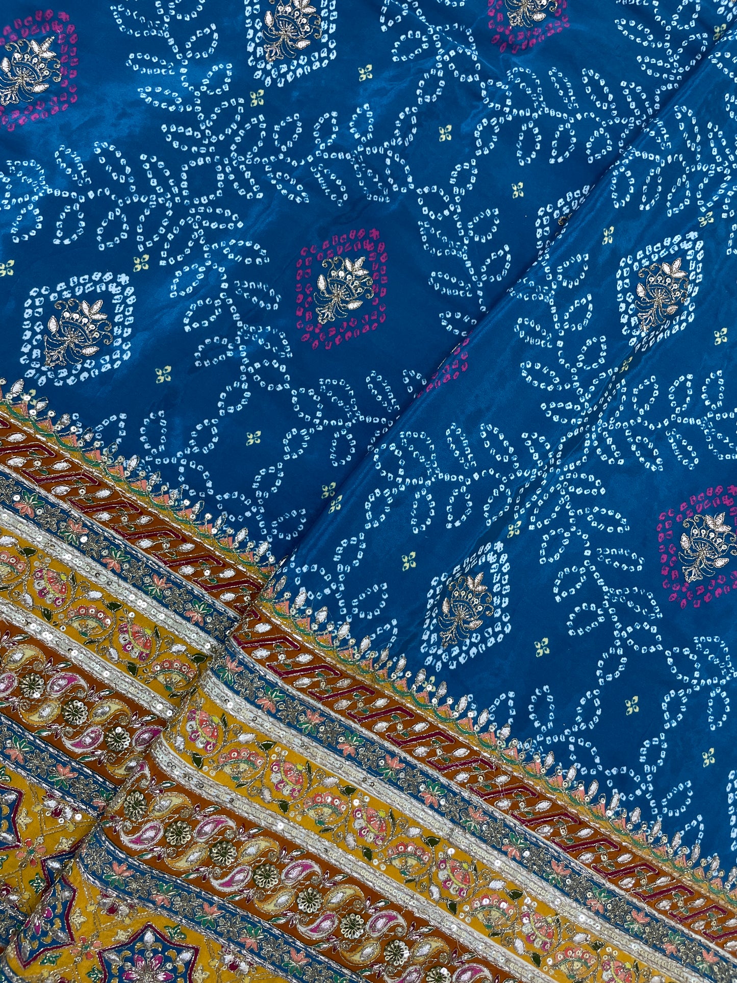 Adorable Bandhani Print With Border Work On Crepe Fabric