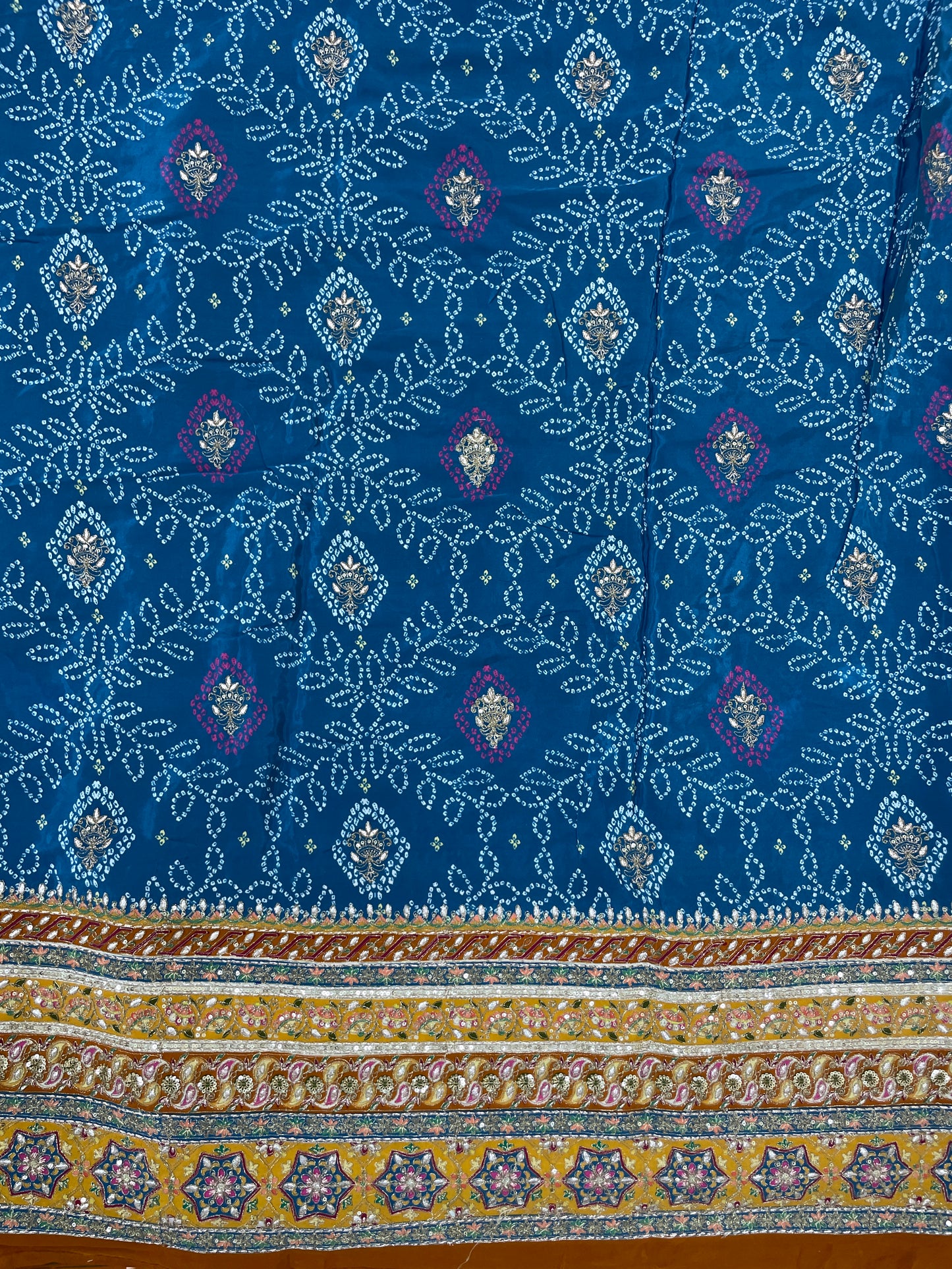 Adorable Bandhani Print With Border Work On Crepe Fabric