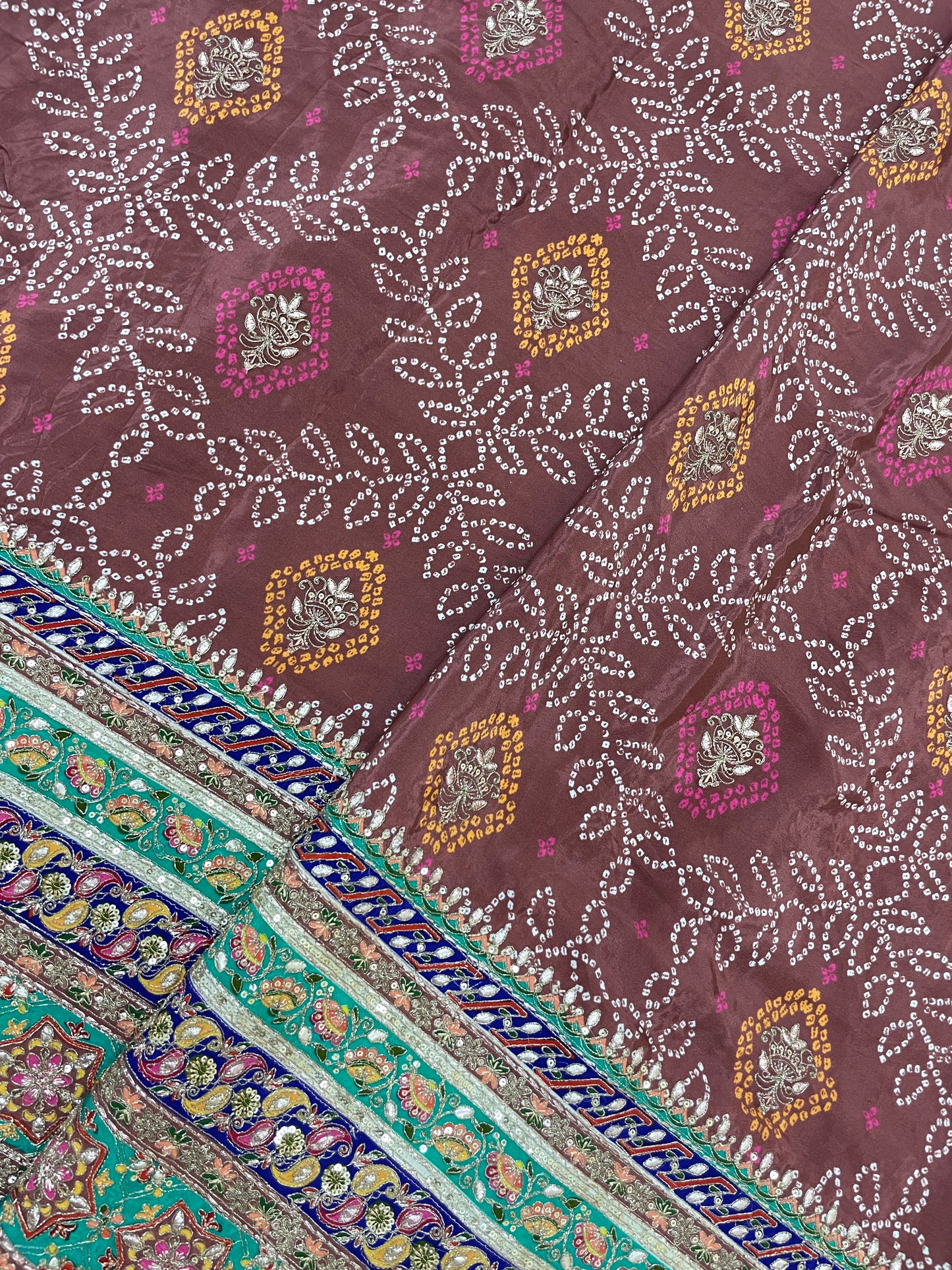 Adorable Bandhani Print With Border Work On Crepe Fabric