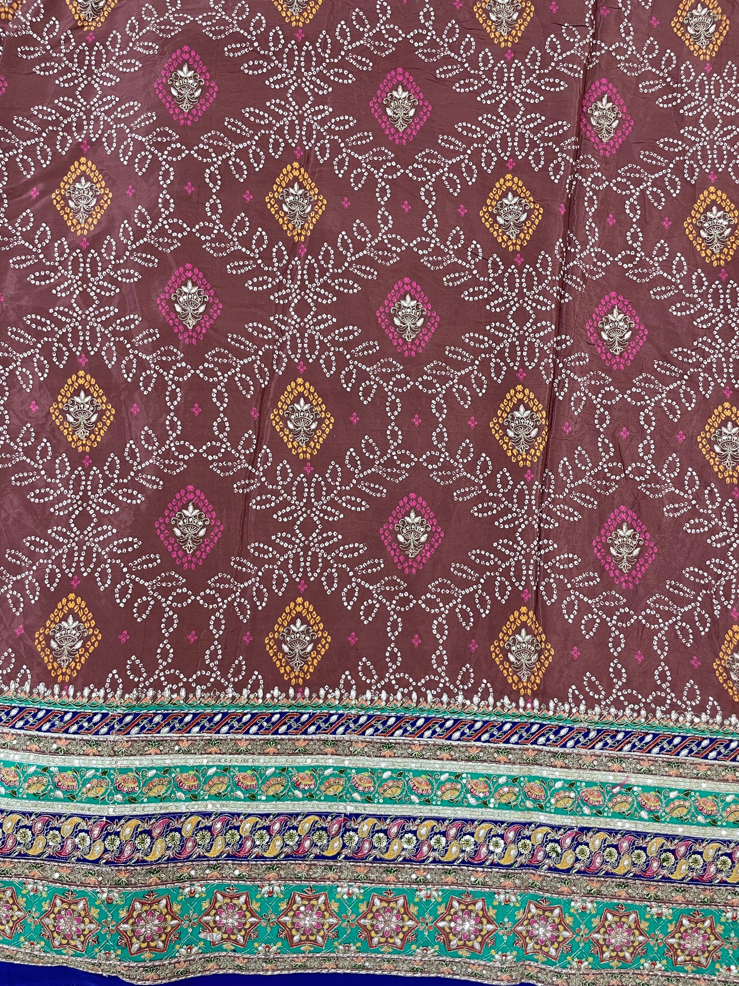 Adorable Bandhani Print With Border Work On Crepe Fabric