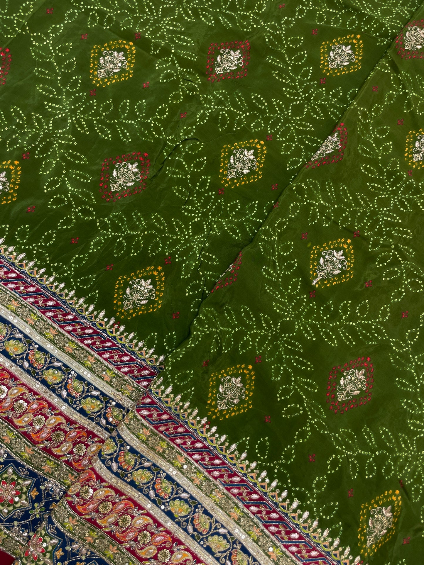 Adorable Bandhani Print With Border Work On Crepe Fabric