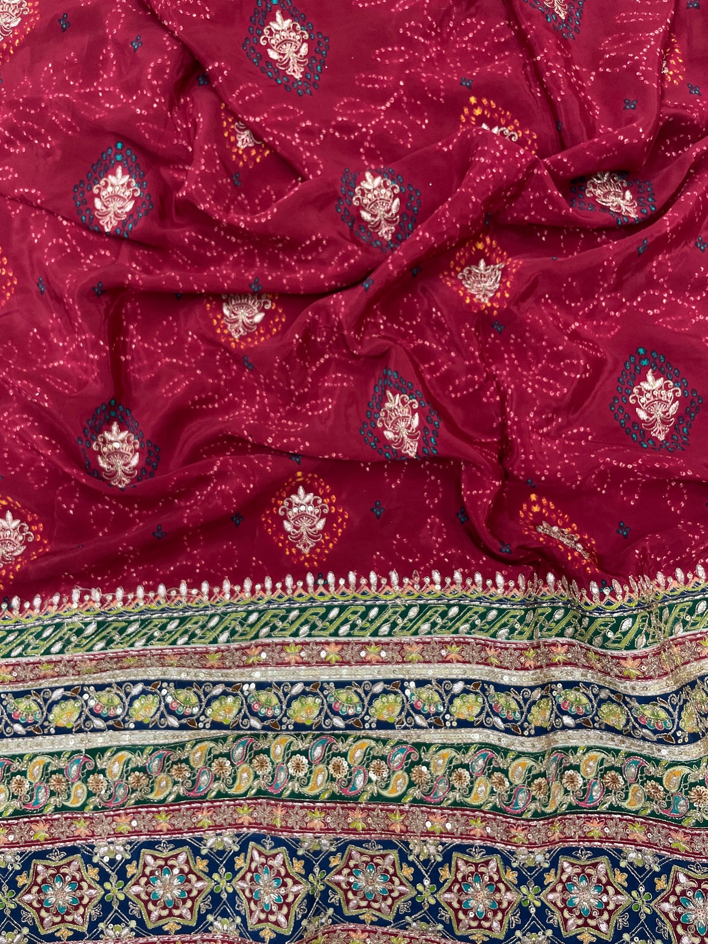 Adorable Bandhani Print With Border Work On Crepe Fabric