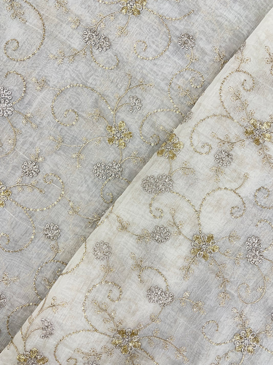 Shiny Vibrant Golden And Silver Zari Floral Work On White Dyeable Chanderi Silk Fabric