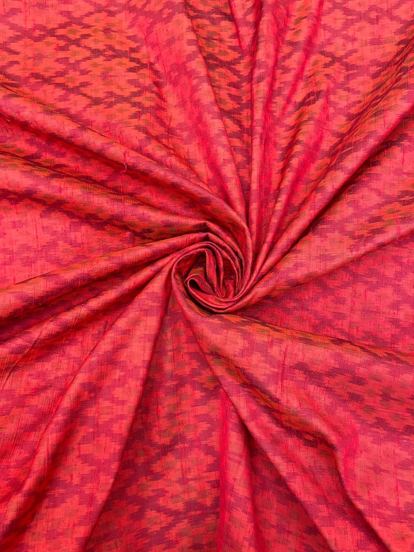 Subtle Yet Elegant Traditional Weaving On Red Colored Raw Silk Ikat