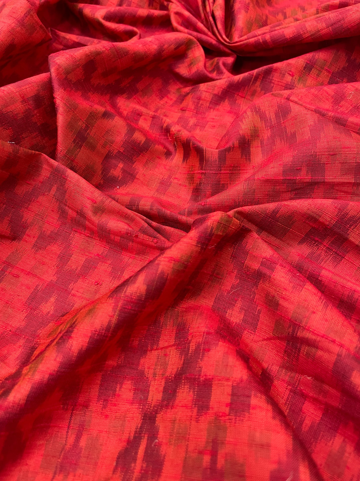 Subtle Yet Elegant Traditional Weaving On Red Colored Raw Silk Ikat