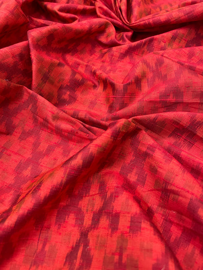 Subtle Yet Elegant Traditional Weaving On Red Colored Raw Silk Ikat