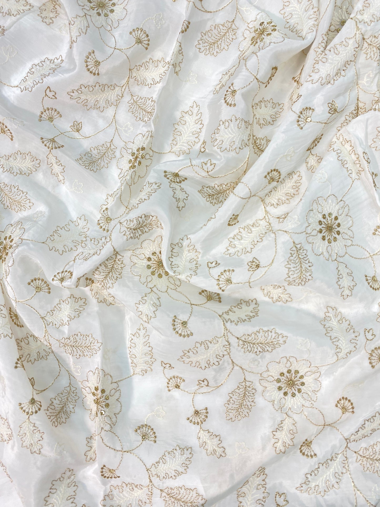 Classic Delicate Unique Flowers And Leaves Zari Embroidery With Sequin Work On White Dyeable Crepe Fabric