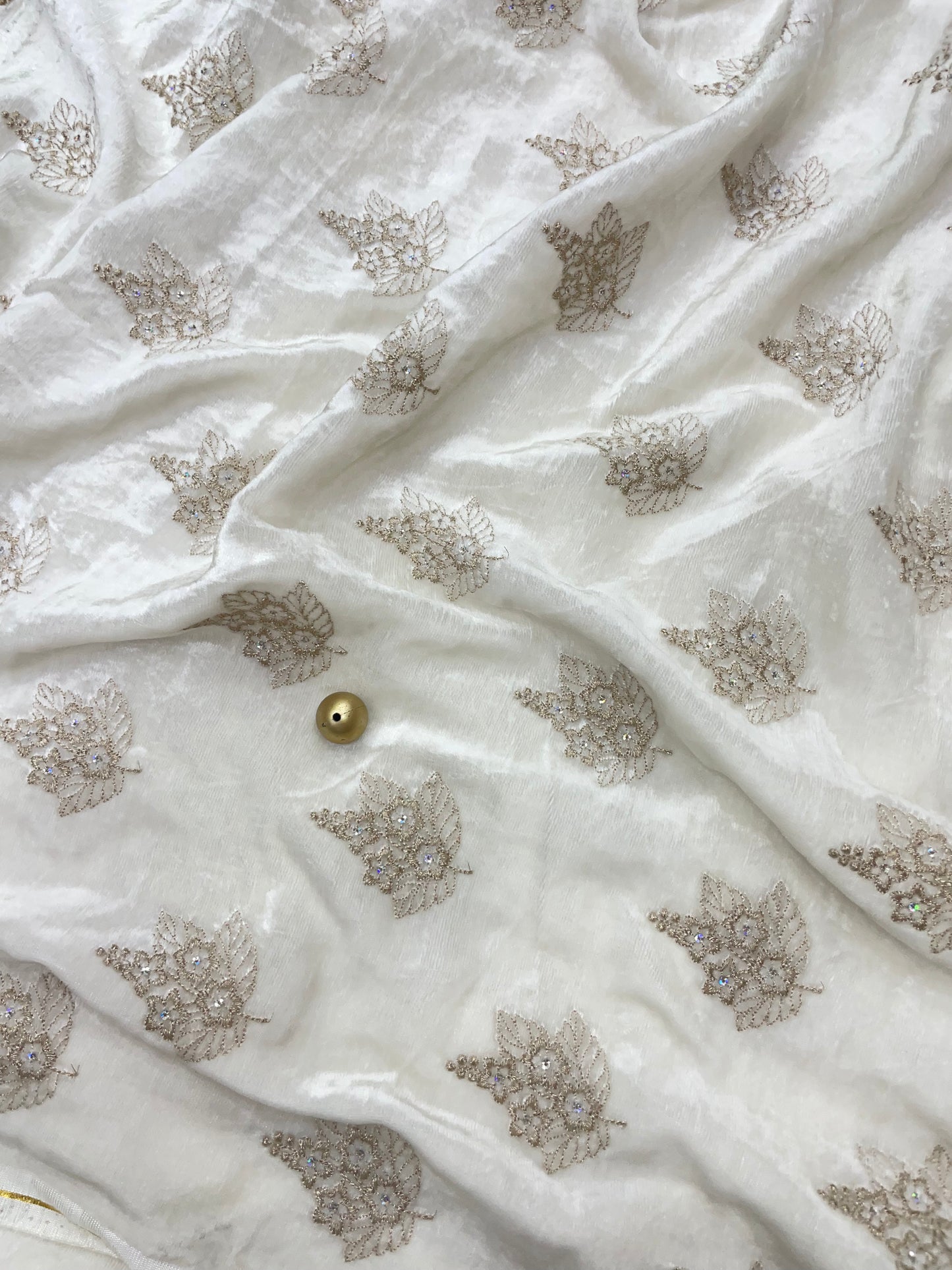 Elegant Beautiful Dainty Floral And Leafy Copper Zari Embroidery With Sequin Work On White Dyeable Velvet Fabric