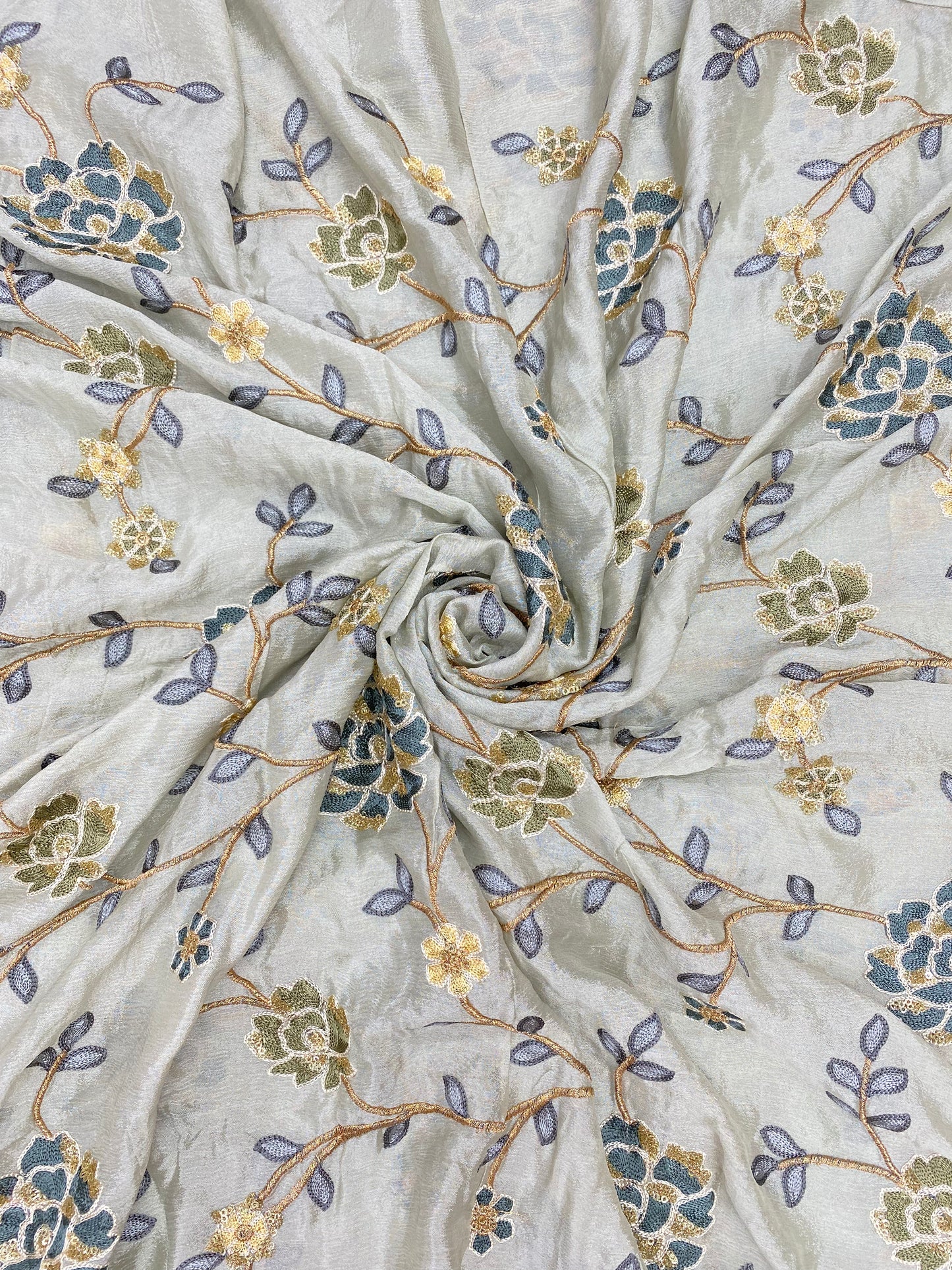 Subtle Yet Elegant Multi Color Floral Thread Embroidery With Golden Sequin And Zari Work On Chinon Fabric