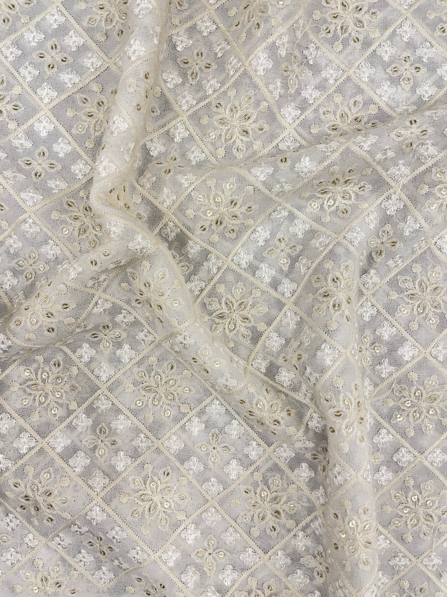 Premium Eye Catching All Over White And Off White Thread Embroidery With Sequin Work On White Dyeable Georgette Fabric