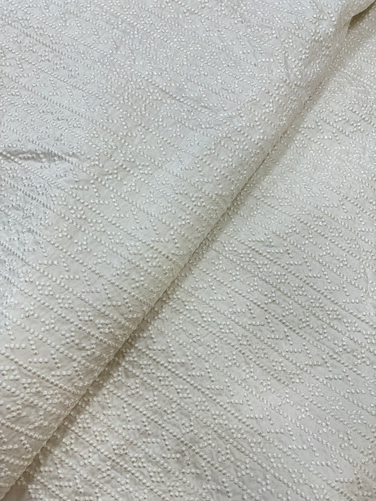 Embossed Dotted Jacquard Pattern on White Dyeable Mysore Silk Fabric