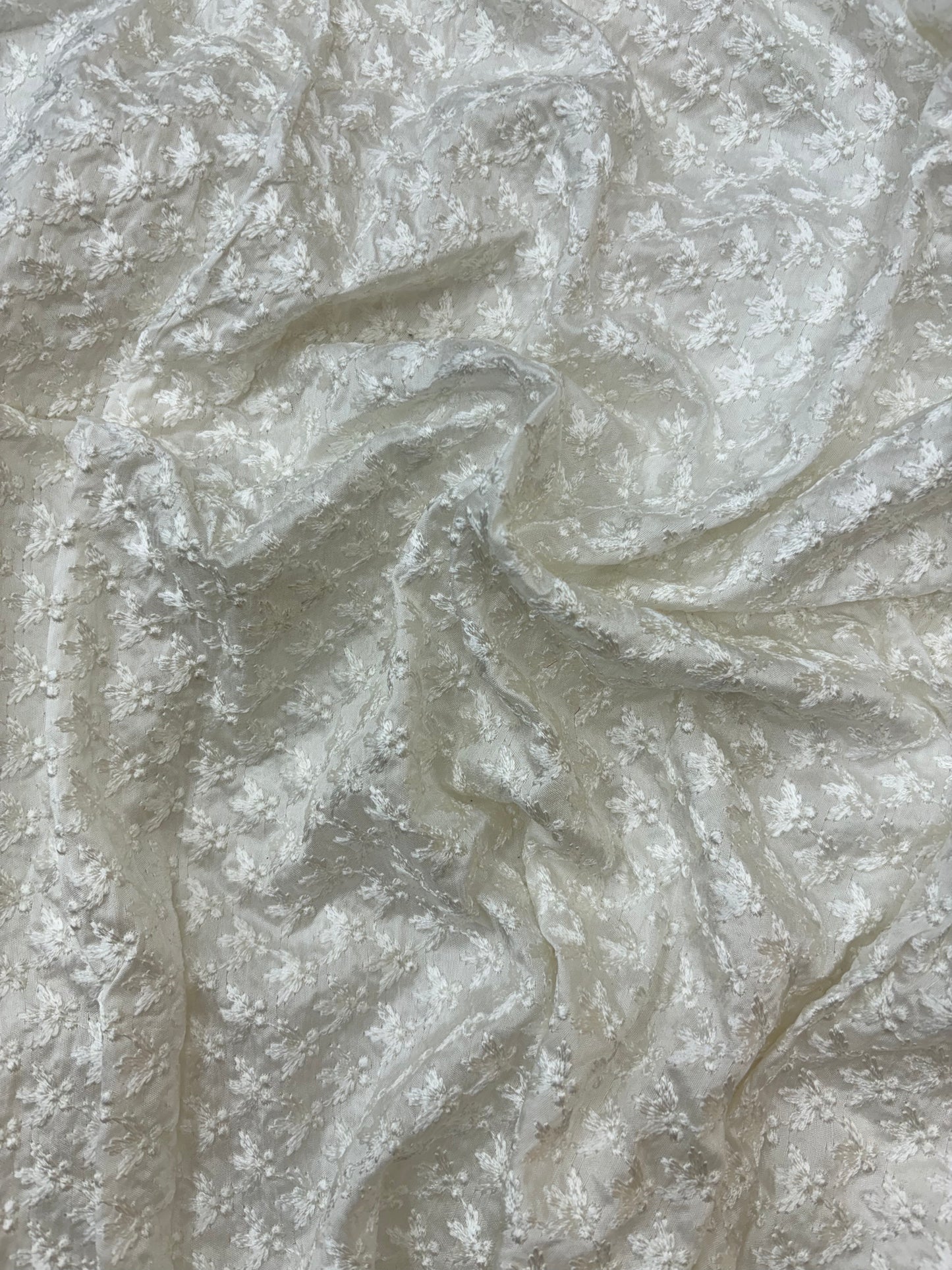 Textured Floral Pattern on White Dyeable Mysore Silk Fabric