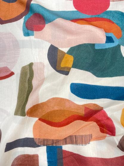 Subtle Yet Elegant Multi Color Print On Muslin Fabric