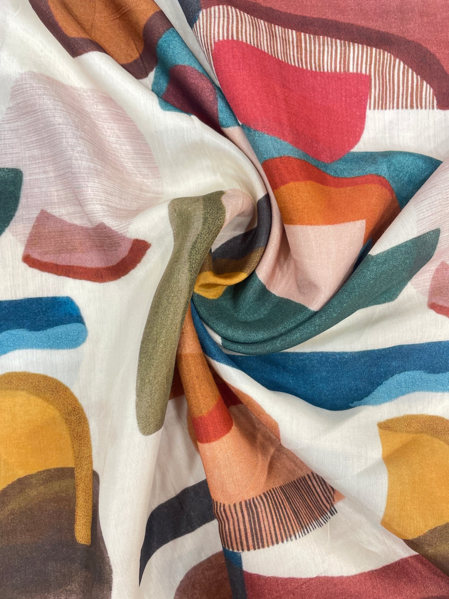 Subtle Yet Elegant Multi Color Print On Muslin Fabric