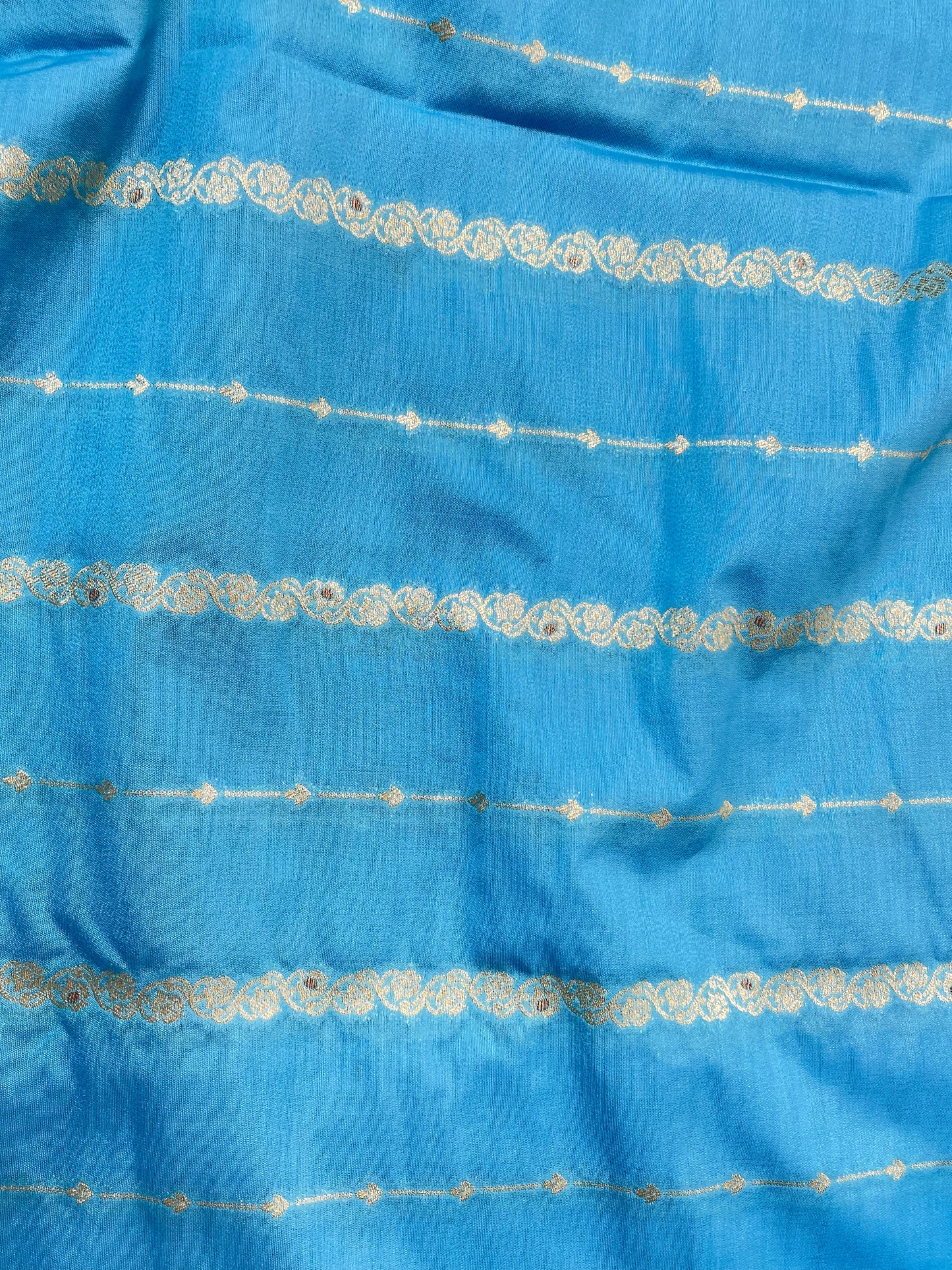 Fabulous Eye Catching Ethnic Dainty Floral And Parallel Line Zari Weaving On Munga Silk Fabric