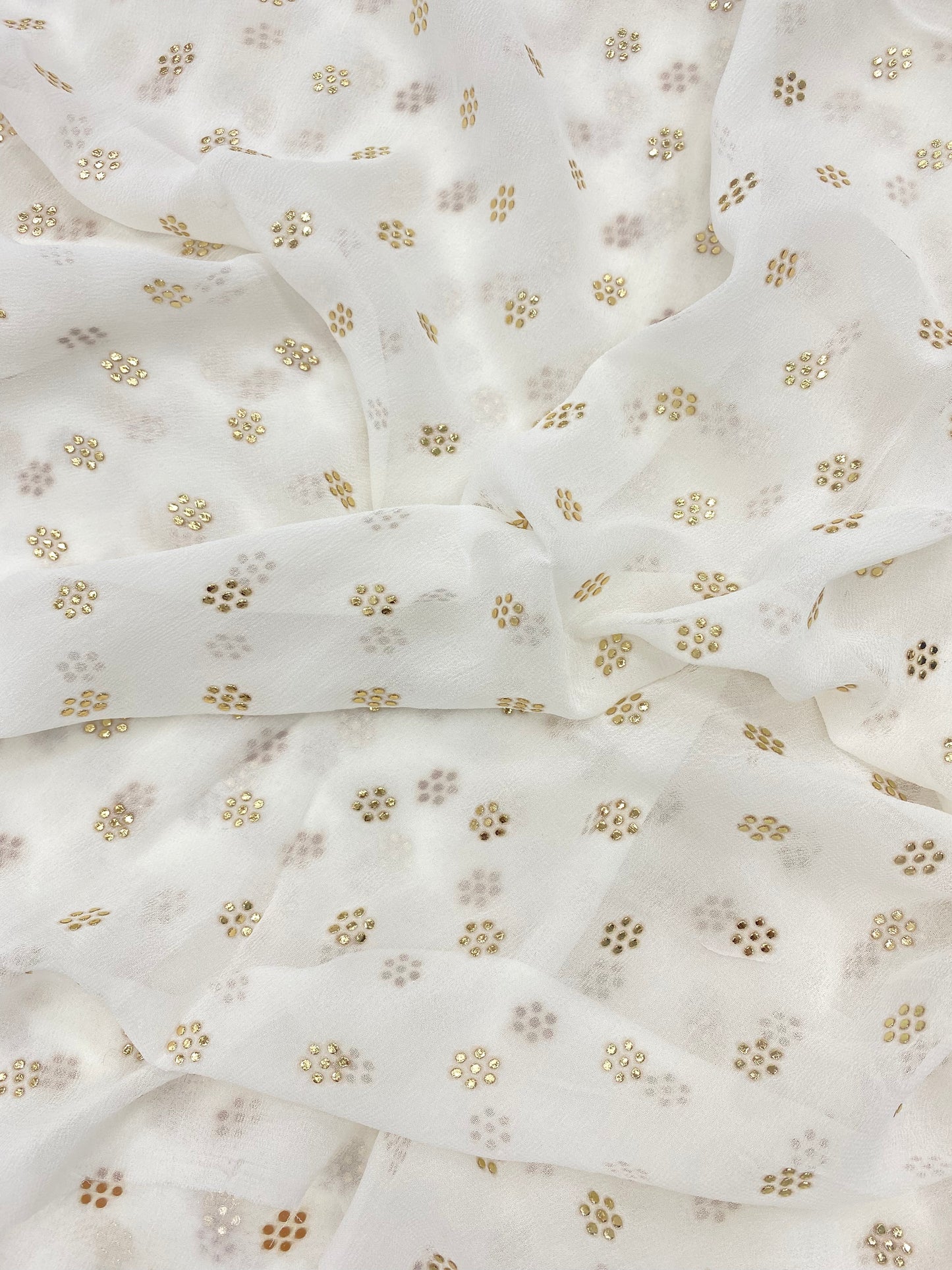 Beautiful Subtle Yet Elegant Golden Floral Mukesh Work On White Dyeable Viscose Organza Fabric