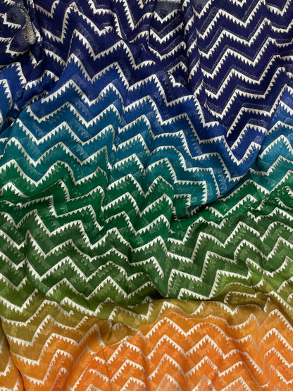 Unique Eye Catching Multi Color Print With Zig Zag Golden Zari Work On Organza Fabric