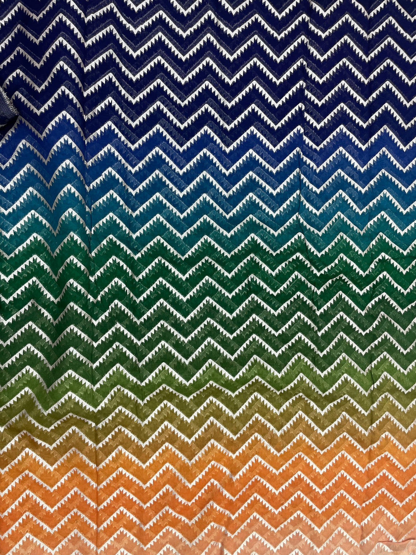 Unique Eye Catching Multi Color Print With Zig Zag Golden Zari Work On Organza Fabric